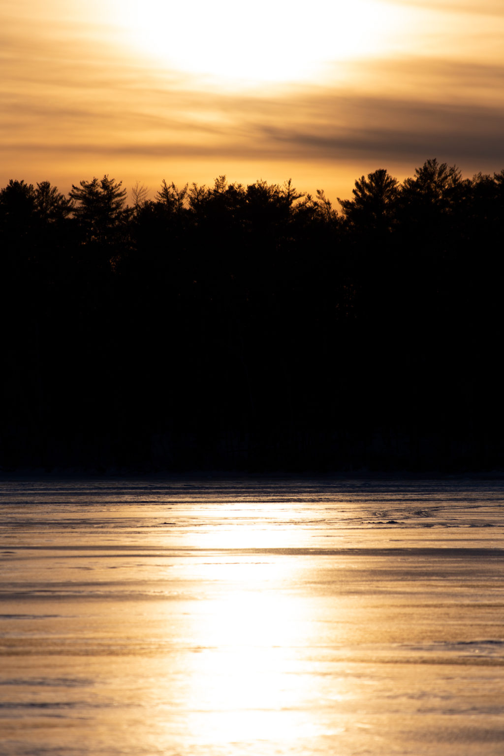 Sun Reflected on Frozen Lake