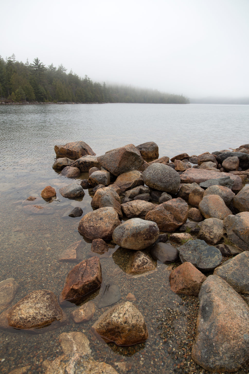 Pile of Rocks in Foggy Lake