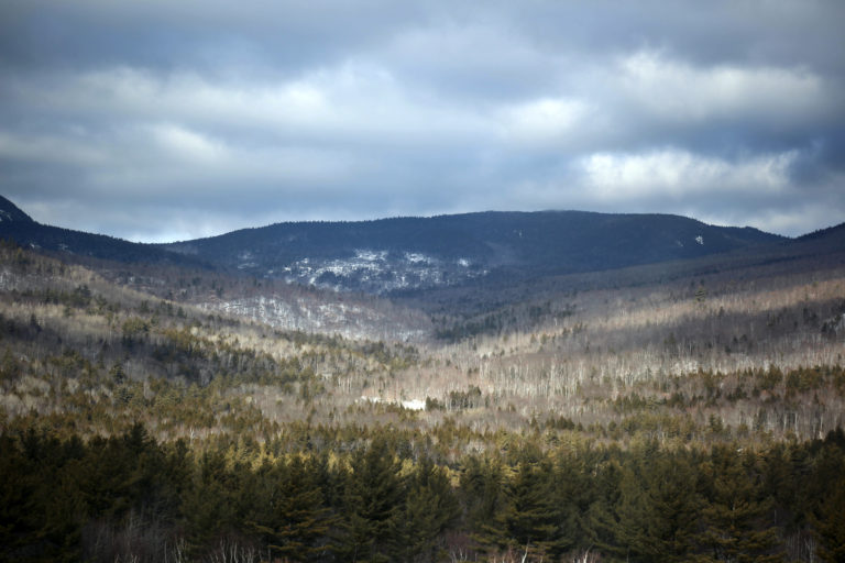 Clouds Over Snow-Dusted Landscape