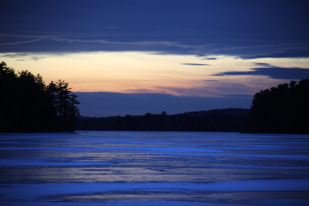 Frozen Lake Reflecting Sunset Sky