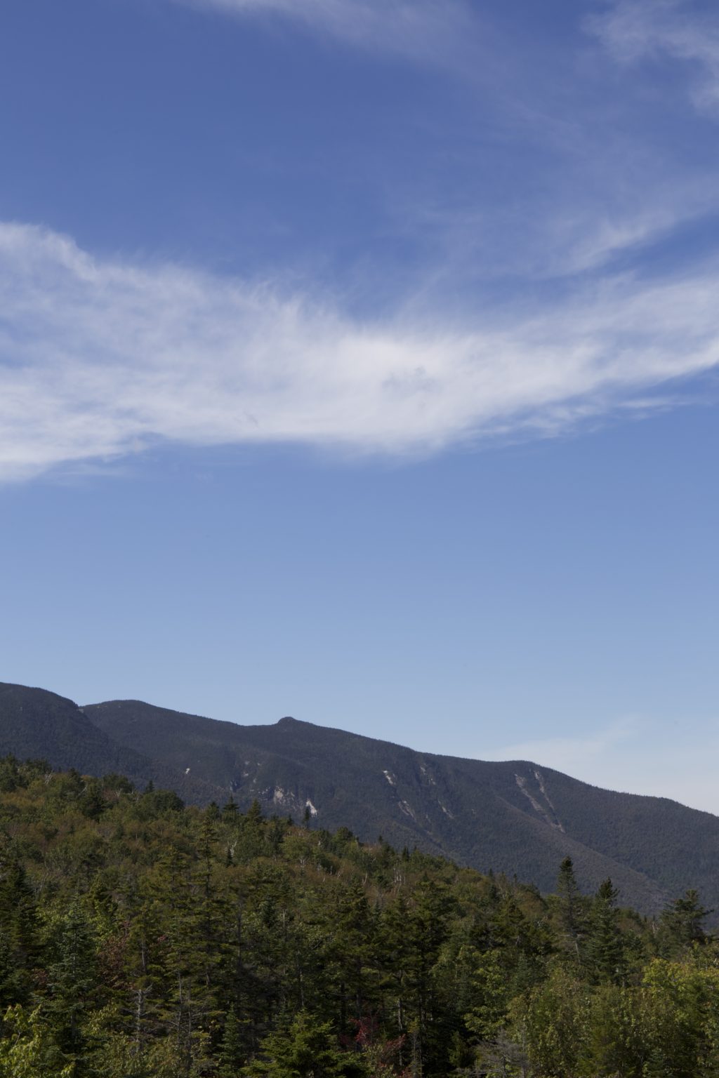 Thin Wispy Clouds Over Mountain Ridge