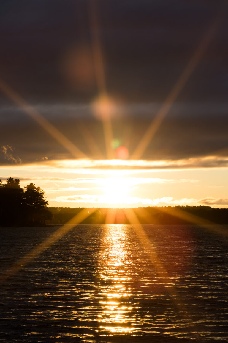 Rays of Light at Sunset Over Water