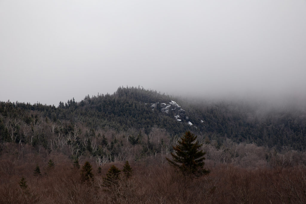 A Touch of Snow on Foggy Hillside