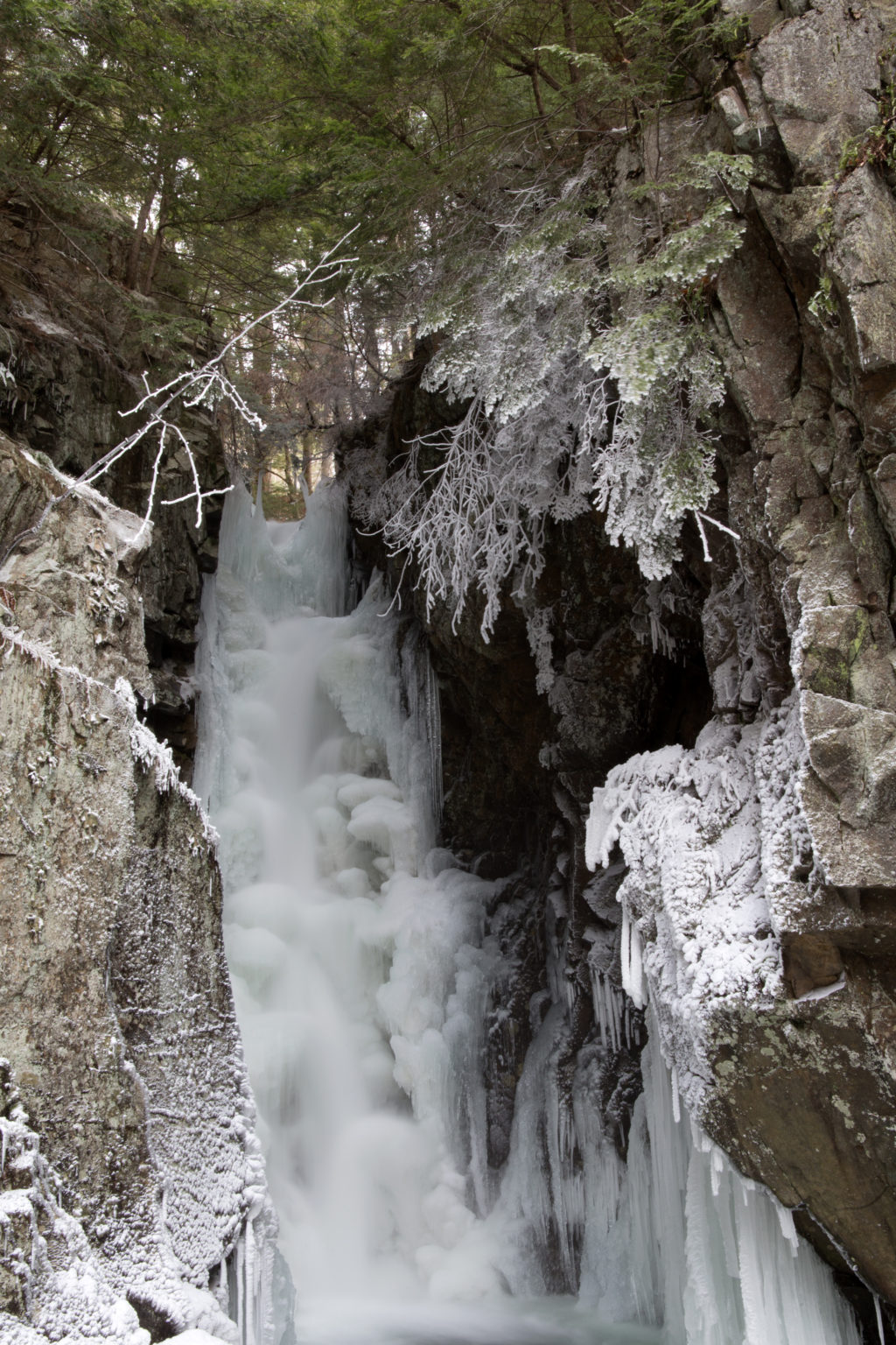 Frozen Waterfall Amongst Cliffs