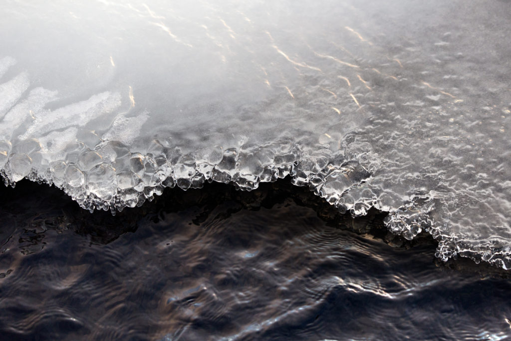 Ice Crystals on Water’s Edge